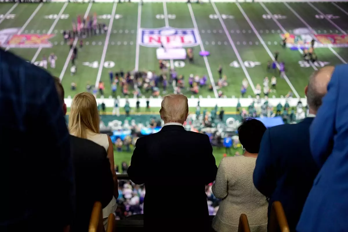 FILE - President Donald Trump, center, attends the NFL Super Bowl 59 football game between the Philadelphia Eagles and the Kansas City Chiefs, Feb. 9, 2025, in New Orleans. (AP Photo/Ben Curtis, File)