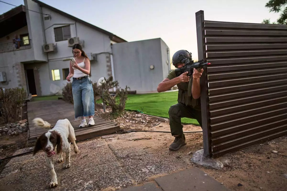 A member of the Yesha community attends military training during the simulation of a militant attack, under the direction of volunteers from a group called Magen48, in southern Israel along the border with Gaza, Sunday, Oct. 4, 2026. (AP Photo/Oded Balilty)