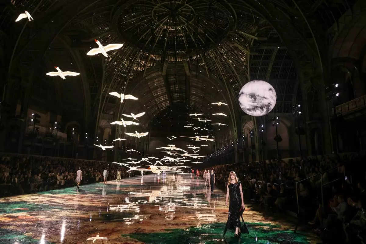 Models wear creations as part of the Chanel Womenswear Spring Summer 2027 collection presented in Paris, France, Monday, Oct. 5, 2026. (AP Photo/Thomas Padilla)