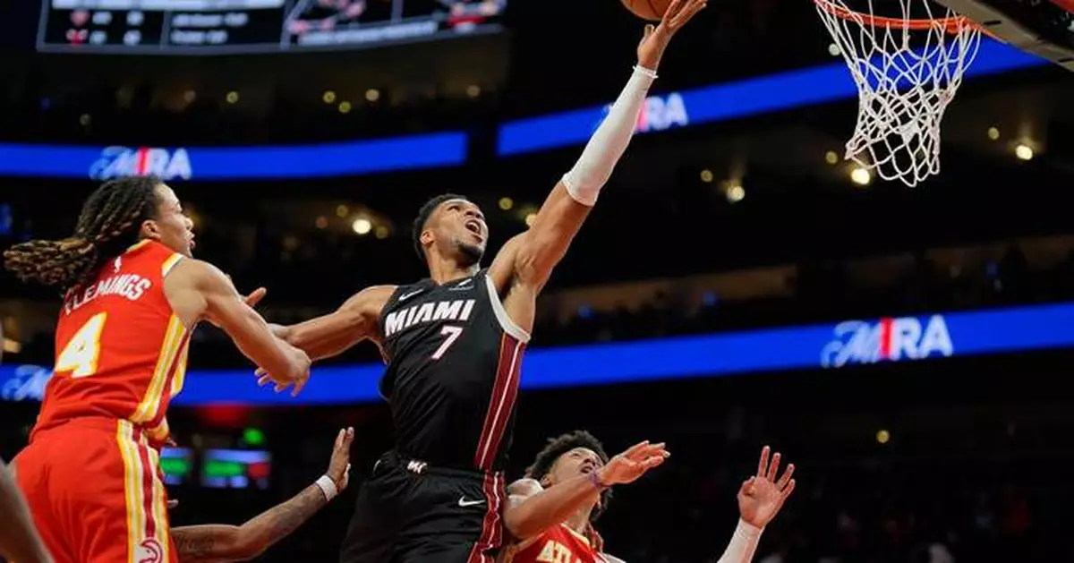 Giannis Antetokounmpo has 24 points, 18 rebounds as the Heat beat the Hawks 129-117 for first win