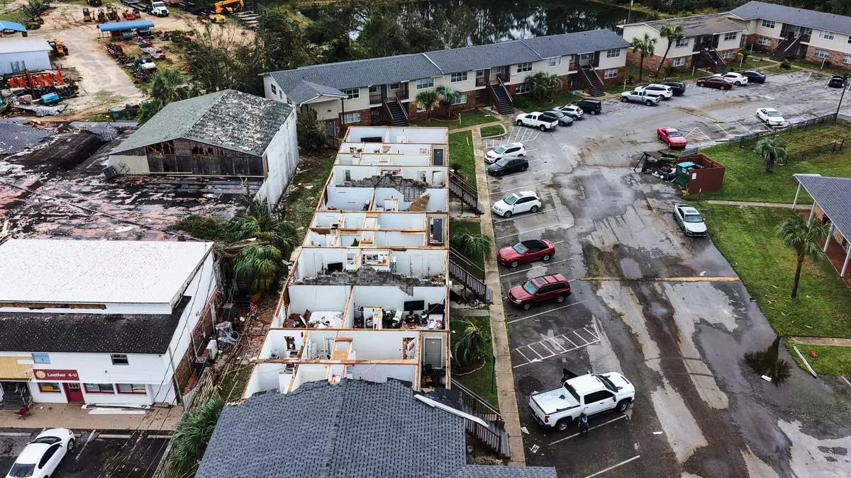 An apartment complex which had its roof ripped off is seen in the aftermath of Hurricane Isaias in Milton, Fla., Saturday, Oct. 10, 2026. (AP Photo/Gerald Herbert)