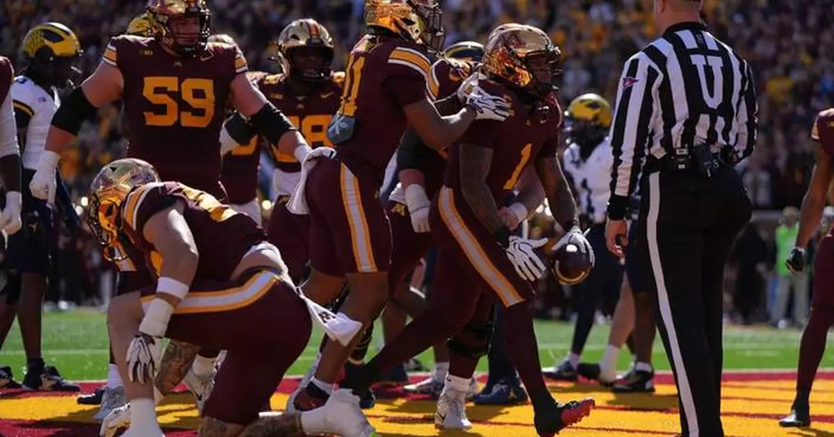 Minnesota beats Michigan 20-14 behind a dominant defense for a rare lift of the Little Brown Jug