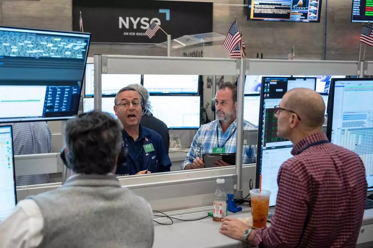 Options trader Matt Hefter works on the floor of the New York Stock Exchange, Thursday, Oct. 8, 2026, in New York. (AP Photo/Yuki Iwamura)