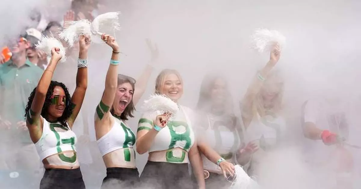 No. 1 Miami, in its first game atop AP poll since 2002 season, rolls past Pitt 52-23
