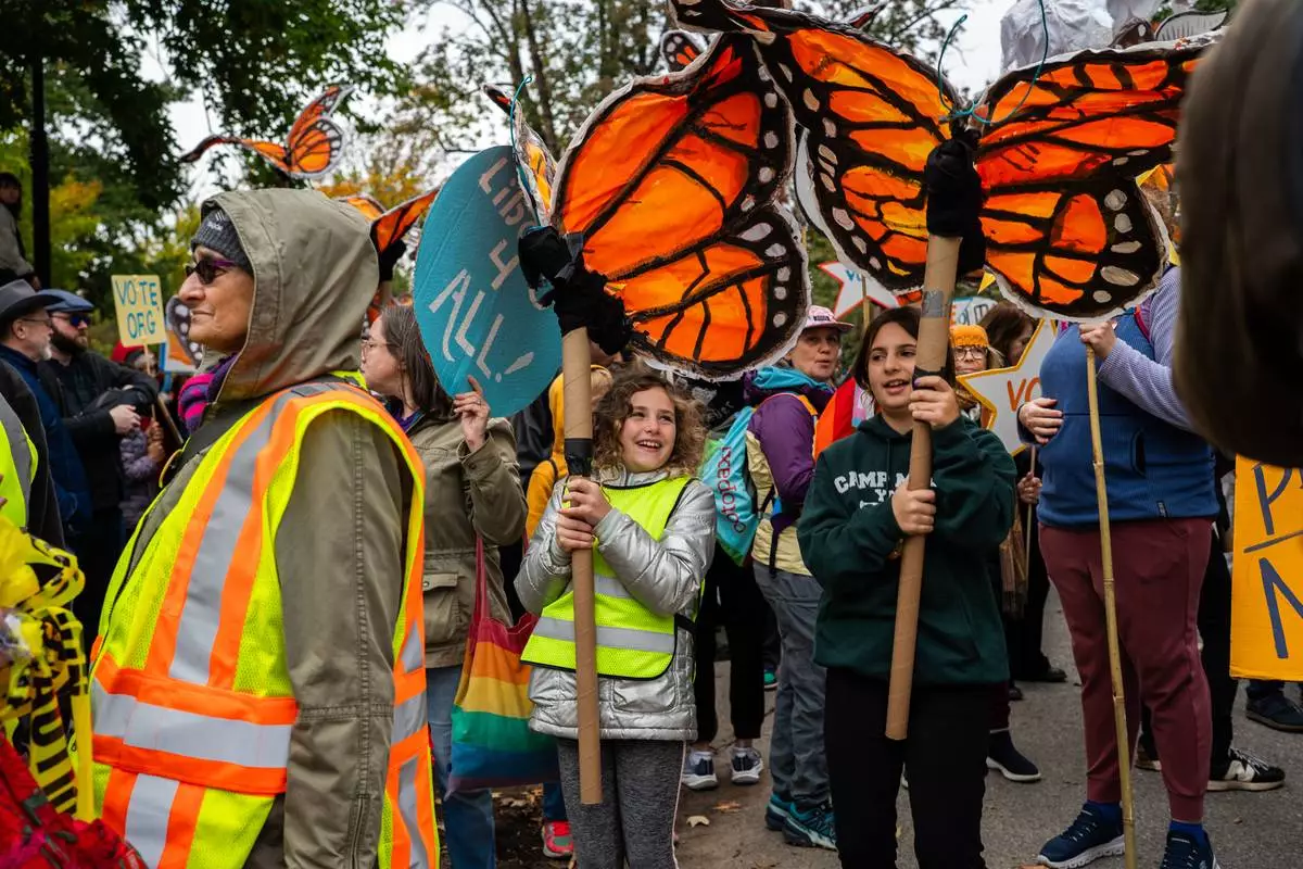 Protesters gather for a "No Kings" rally on Saturday, Oct. 17, 2026, in New York. (AP Photo/Madison Swart)