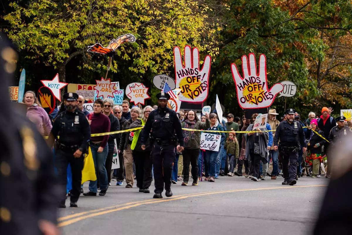 Protesters gather for a "No Kings" rally on Saturday, Oct. 17, 2026, in New York. (AP Photo/Madison Swart)