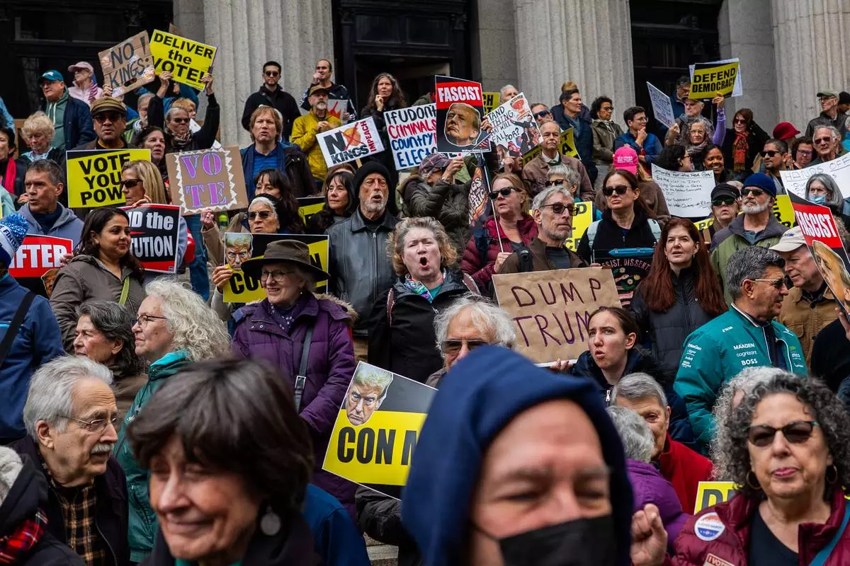 Protesters gather for a "No Kings" rally on Saturday, Oct. 17, 2026, in New York. (AP Photo/Madison Swart)