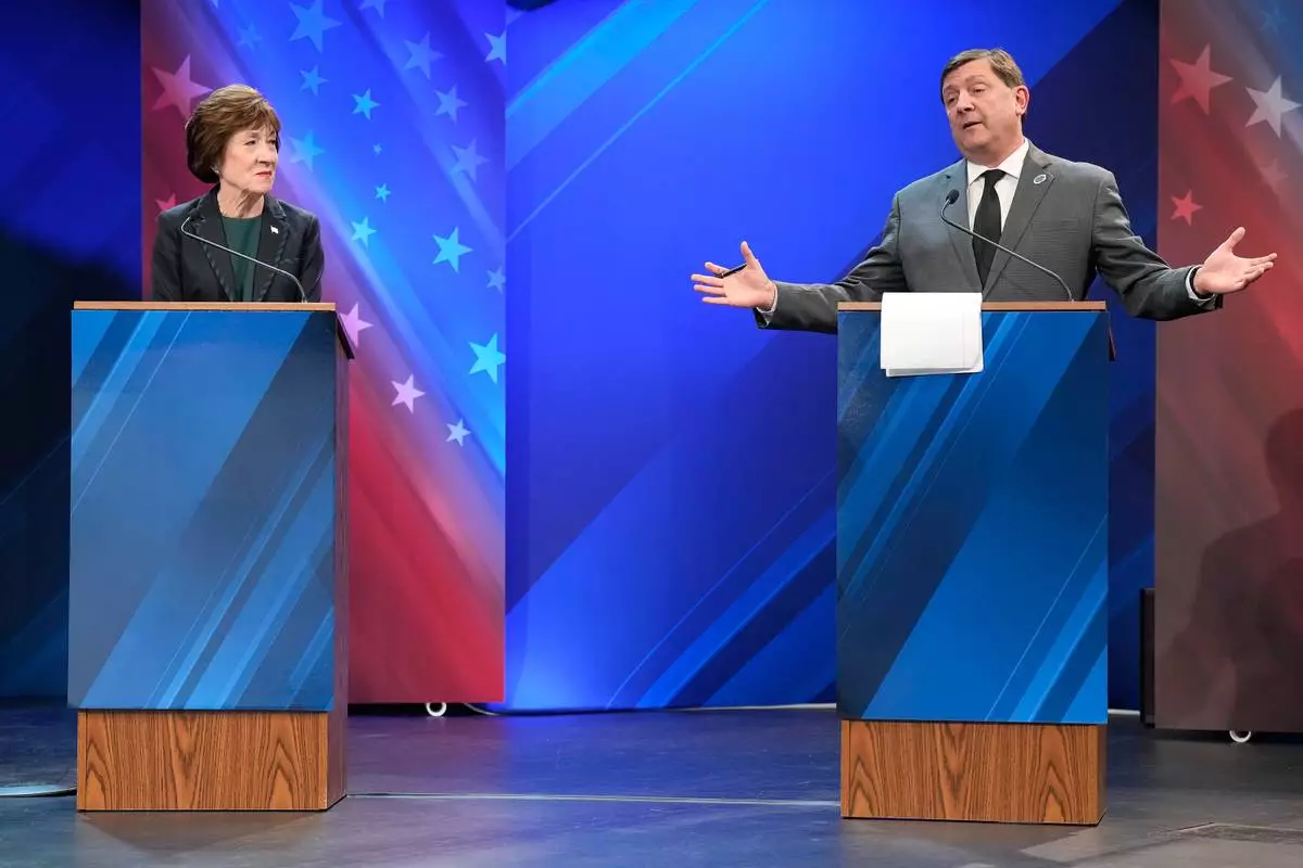 Sen. Susan Collins (R) looks to Troy Jackson (D) as he answers a question during the final Maine U.S. Senate debate in Bangor, Maine, Thursday, Oct. 15, 2026. (Gregory A. Rec/Portland Press Herald via AP, Pool)