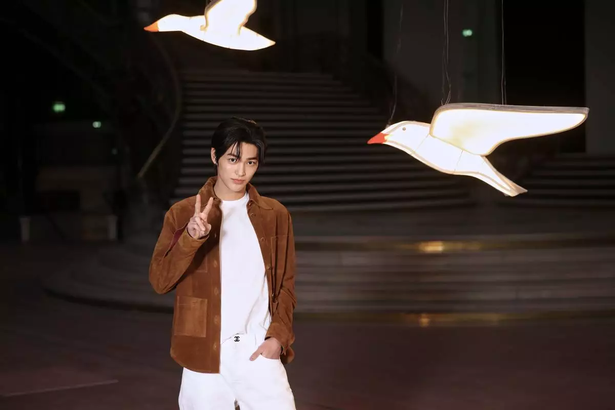 Keonho poses upon arrival at the Chanel Womenswear Spring Summer 2027 collection presented in Paris, France, Monday, Oct. 5, 2026. (AP Photo/Thomas Padilla)