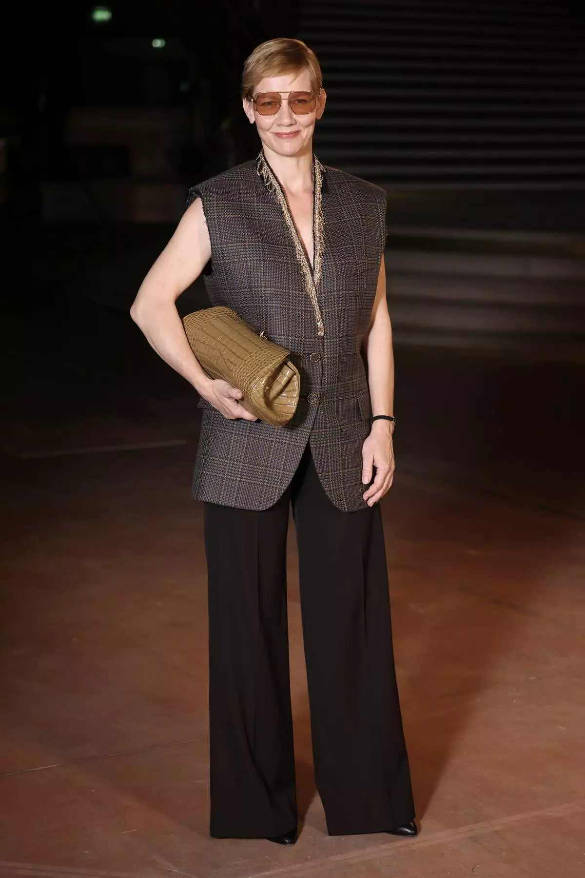 Sandra Huller poses upon arrival at the Chanel Womenswear Spring Summer 2027 collection presented in Paris, France, Monday, Oct. 5, 2026. (AP Photo/Thomas Padilla)