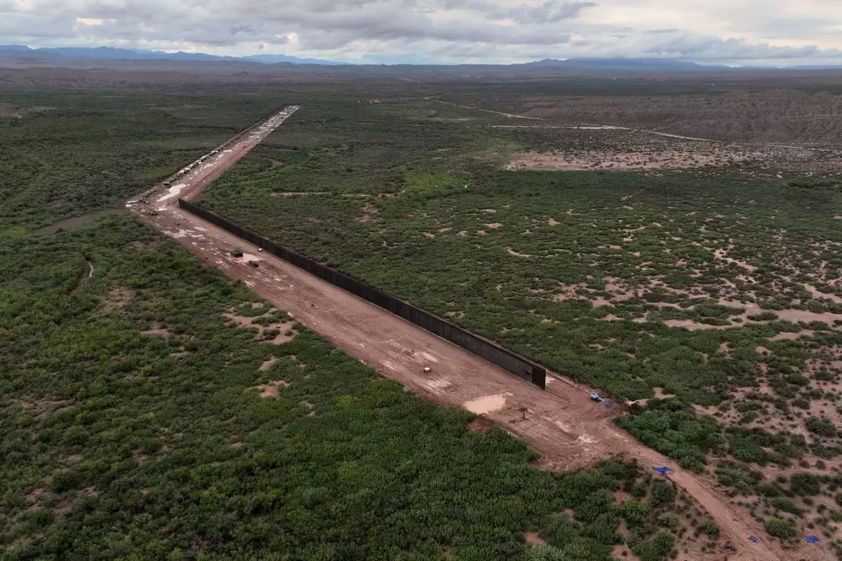 A portion of border wall is under construction in the Big Bend region, Wednesday, Sept. 23, 2026, near Sierra Blanca, Texas. (AP Photo/John Locher)