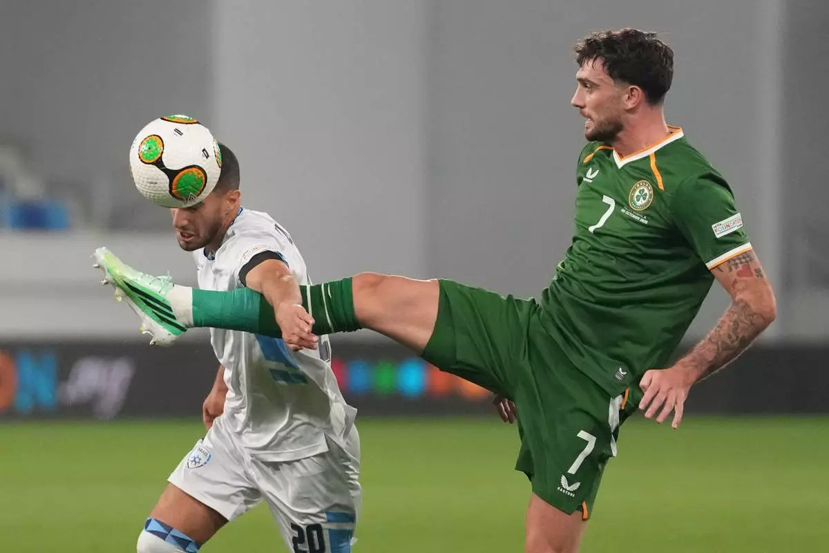 Israel's Liel Abada, left, and Ireland's Troy Parrott fight for the ball during the UEFA Nations League soccer match between the Republic of Ireland and Israel in Backa Topola, Serbia, Sunday, Oct. 4, 2026. (AP Photo/Darko Vojinovic)