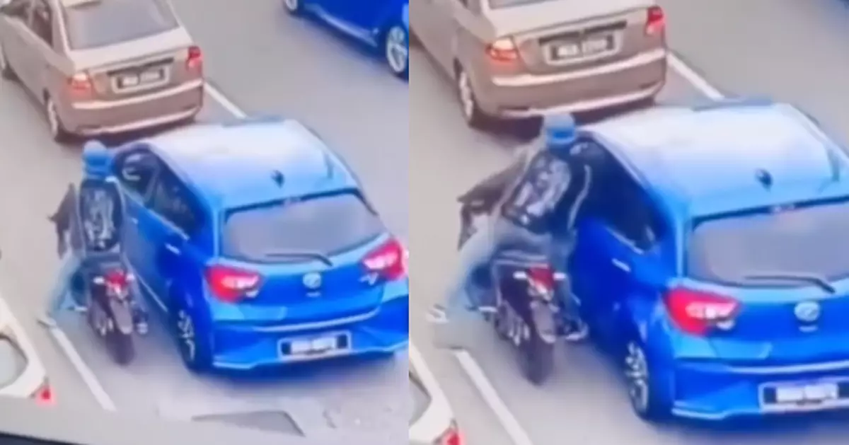 大馬副駕乘客等紅燈車窗大開玩手機 遭電單車搶匪一把奪走