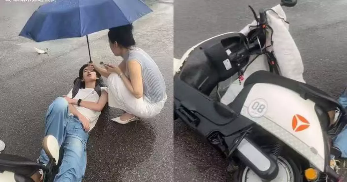 雨天被車撞倒無助躺路邊 安徽男學生獲熱心女途人撐傘守護至救援到場