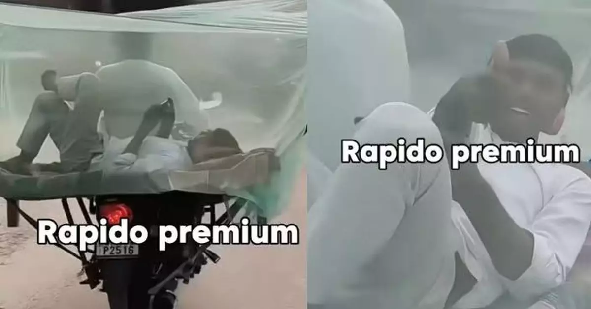 電單車後綁大型蚊帳布罩 印度男橫躺其中翹腳玩手機 離奇畫面曝光