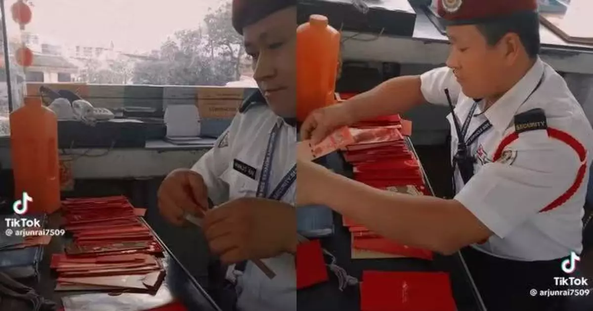 新年大豐收收逾40封利市 大馬保安曬「錢數到手軟」影片羨煞網民