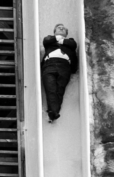 FILE - In this Sept. 11, 1987 file photo, the Rev. Jerry Falwell slides down the 'Killer Typhoon' waterslide at the Heritage USA water park in Fort Mill, S.C. On Tuesday, Aug. 25, 2020, his son, Jerry Falwell Jr. said that he has submitted his resignation as head of evangelical Liberty University. (Andy BurrissThe Herald via AP)
