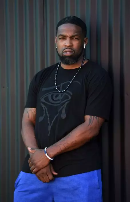 This Aug. 15, 2019 photo shows Timothy "Tim" Simmons, a cast member in the reality television series "Black Ink Crew: Compton," at the IAM Compton tattoo shop in Compton, Calif. The show, which airs Wednesdays on VH1, follows the cast who attempt to create a “safe zone” in one of the tougher cities in California. The reality series is the third spinoff of the “Black Ink Crew” franchise. (Photo by Chris PizzelloInvisionAP)