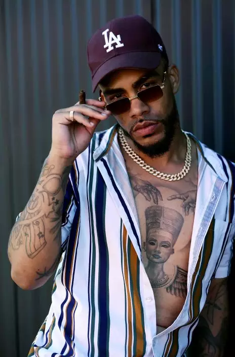 This Aug. 15, 2019 photo shows Christian "Ink Drippin'" Thomas, a cast member in the reality television series "Black Ink Crew: Compton," at the IAM Compton tattoo shop in Compton, Calif. The show, which airs Wednesdays on VH1, follows the cast who attempt to create a “safe zone” in one of the tougher cities in California. The reality series is the third spinoff of the “Black Ink Crew” franchise. (Photo by Chris PizzelloInvisionAP)
