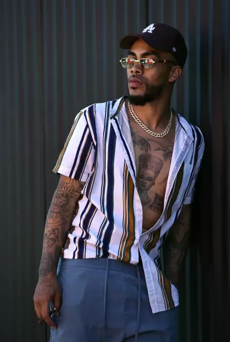 This Aug. 15, 2019 photo shows Christian "Ink Drippin'" Thomas, a cast member in the reality television series "Black Ink Crew: Compton," at the IAM Compton tattoo shop in Compton, Calif. The show, which airs Wednesdays on VH1, follows the cast who attempt to create a “safe zone” in one of the tougher cities in California. The reality series is the third spinoff of the “Black Ink Crew” franchise. (Photo by Chris PizzelloInvisionAP)