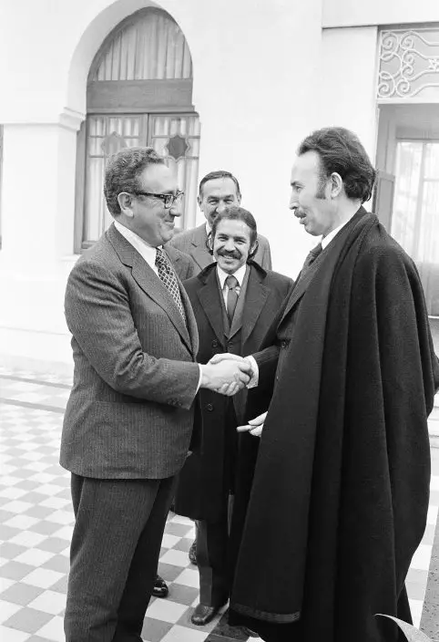 FILE - In this Dec. 14, 1973 file photo, the then Algerian Foreign Minister Abdelaziz Bouteflika, centre, looks on as U.S. Secretary of State Henry Kissinger, left, takes leave of President Houari Boumedienne of Algeria after talks in Algiers. Bouteflika became foreign minister at the young age of 25, and stood up to the likes of Henry Kissinger at the height of the Cold War, with the Algerian capital Algiers nicknamed "Moscow on the Med." (AP PhotoMichel Lipchitz, File)