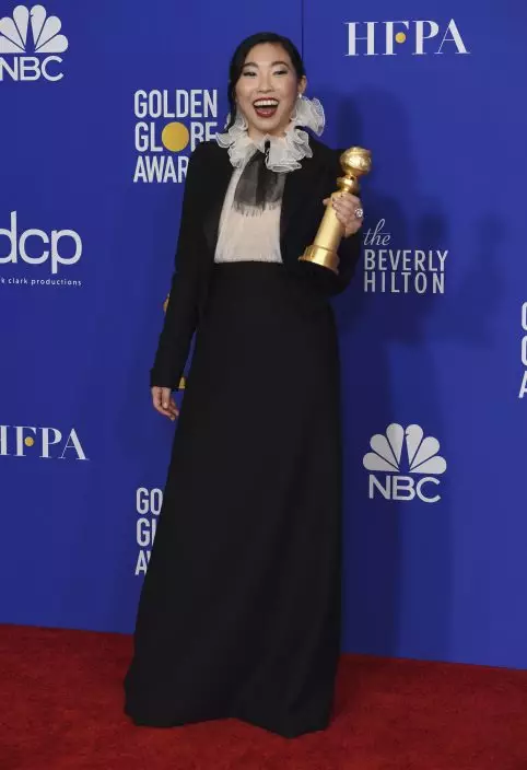 Awkwafina poses in the press room with the award for best performance by an actress in a motion picture, musical or comedy for "The Farewell" at the 77th annual Golden Globe Awards at the Beverly Hilton Hotel on Sunday, Jan. 5, 2020, in Beverly Hills, Calif. (AP PhotoChris Pizzello)