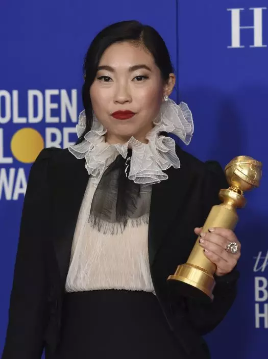 Awkwafina poses in the press room with the award for best performance by an actress in a motion picture, musical or comedy for "The Farewell" at the 77th annual Golden Globe Awards at the Beverly Hilton Hotel on Sunday, Jan. 5, 2020, in Beverly Hills, Calif. (AP PhotoChris Pizzello)