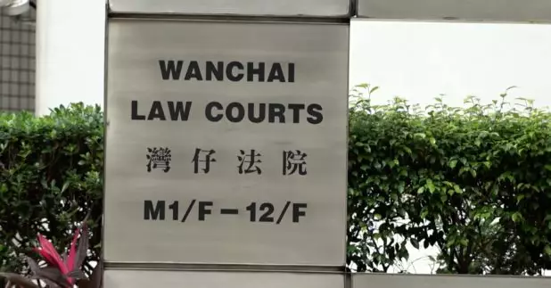 審訊歷時約18個月的理大外圍暴動案，最後一宗判刑案件，8名被告被裁定暴動罪成，暫委法官黃雅茵於區域法院判處8人監禁4年2個月至4年半。（港台圖片）