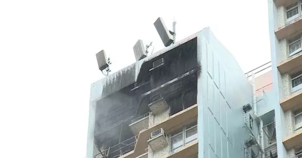 慈雲山慈樂邨樂滿樓發生火警，約20名住客自行疏散。(張連登攝)