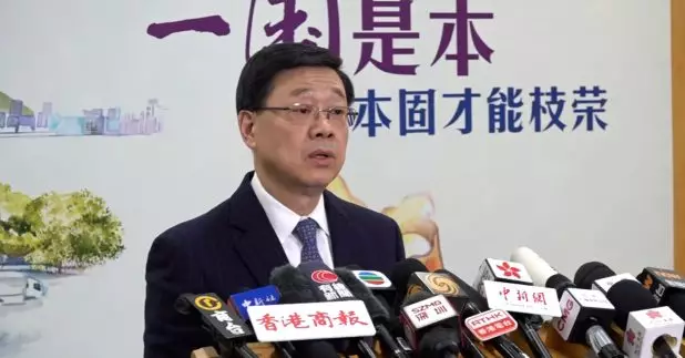 李家超向習近平匯報　法庭裁定黎智英三項控罪成立彰顯法律正義。（黃維波攝）