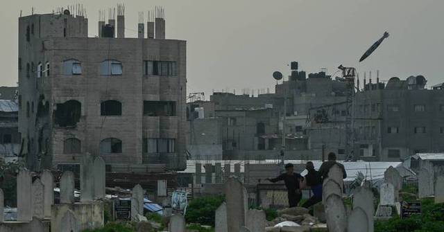 Photos show an Israeli strike blowing up a Gaza building in split ...