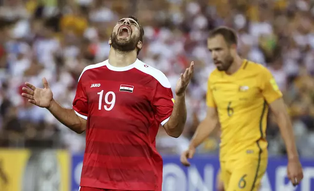 Syria's Mardek Mardkian yells out after missing a chance on the Australian goal during their Soccer World Cup qualifying match in Sydney, Australia, Tuesday, Oct. 10, 2017. (AP Photo/Rick Rycroft)