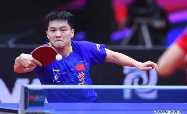 Fan Zhendong of China returns the ball during the men's singles final match between Fan Zhendong of China and his compatriot Ma Long at 2020 ITTF Men's World Cup in Weihai, east China's Shandong Province, Nov. 15, 2020.