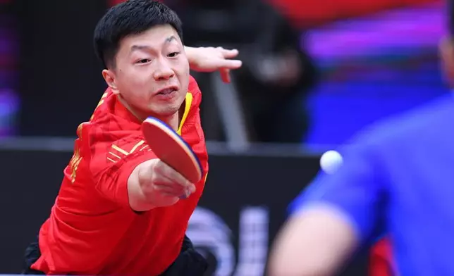 Ma Long of China returns the ball during the men's singles final match between Fan Zhendong of China and his compatriot Ma Long at 2020 ITTF Men's World Cup in Weihai, east China's Shandong Province, Nov. 15, 2020.