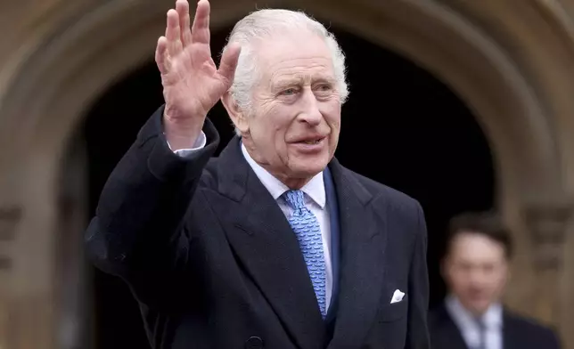 Britain's King Charles III waves as he leaves after attending the Easter Matins Service at St. George's Chapel, Windsor Castle, England, Sunday, March 31, 2024. (Hollie Adams/Pool Photo via AP)