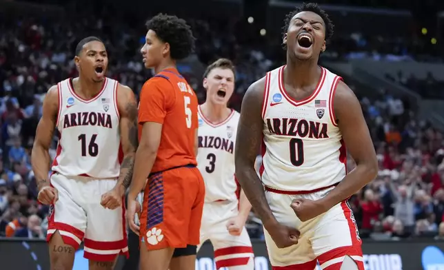 Arizona guard Jaden Bradley (0) celebrates after scoring during the first half of a Sweet 16 college basketball game against Clemson in the NCAA tournament Thursday, March 28, 2024, in Los Angeles. (AP Photo/Ryan Sun)