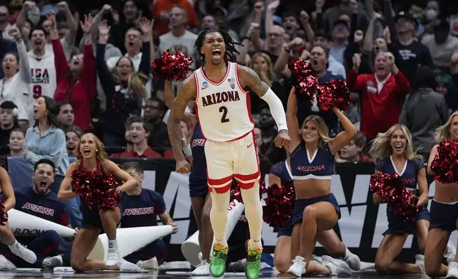 Arizona guard Caleb Love (2) celebrates after scoring during the second half of a Sweet 16 college basketball game against Clemson in the NCAA tournament Thursday, March 28, 2024, in Los Angeles. (AP Photo/Ryan Sun)