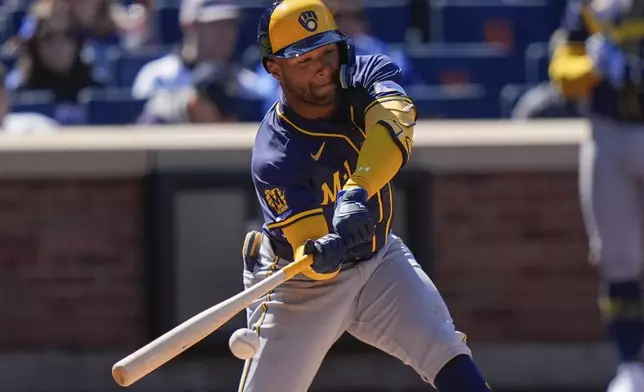 Milwaukee Brewers' Jackson Chourio (11) hits a single during the fifth inning of a baseball game against the New York Mets Friday, March 29, 2024, in New York. (AP Photo/Frank Franklin II)