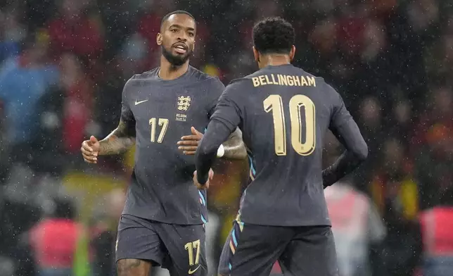 England's Ivan Toney, left, celebrates with his teammate Jude Bellingham after scoring his side's opening goal during an international friendly soccer match between England and Belgium at Wembley Stadium, in London, Tuesday, March 26, 2024. (AP Photo/Kirsty Wigglesworth)