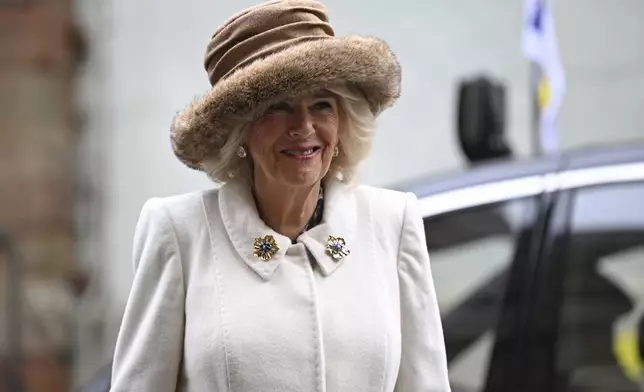 Britain's Queen Camilla smiles as she arrives for the Royal Maundy Service where she distributes the Maundy money to 75 men and 75 women, mirroring the age of the monarch, in Worcester Cathedral, Worcester, England, Thursday, March 28, 2024 to thank them for their outstanding Christian service and for making a difference to the lives of people in their local communities. Maundy Thursday is the Christian holy day falling on the Thursday before Easter. The monarch commemorates Maundy by offering 'alms' to senior citizens. Each recipient receives two purses, one red and one white. (Justin Tallis, Pool Photo via AP)