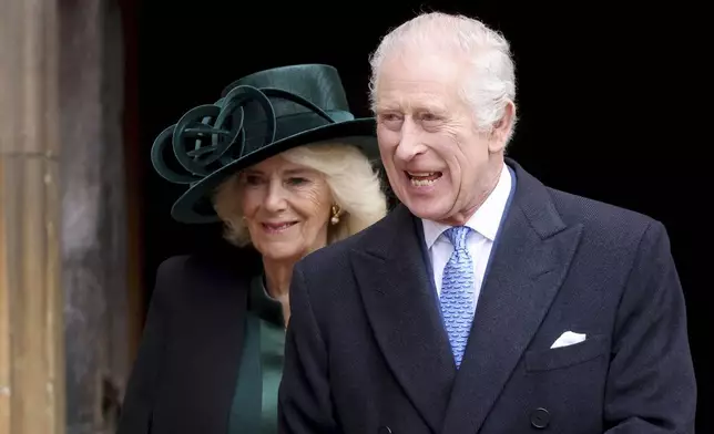 Britain's King Charles III, right, and Queen Camilla leave after attending the Easter Matins Service at St. George's Chapel, Windsor Castle, England, Sunday, March 31, 2024. (Hollie Adams/Pool Photo via AP)