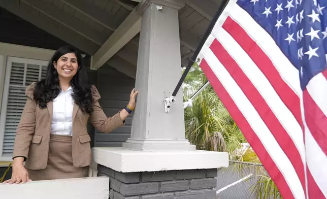 Florida state Rep. Anna Eskamani poses out front of her office Wednesday, March 27, 2024, in Orlando, Fla. For the first time in 27 years, the U.S. government is announcing changes to how it categorizes people by race and ethnicity. "It feels good to be seen," said Eskamani, whose parents are from Iran. (AP Photo/John Raoux)