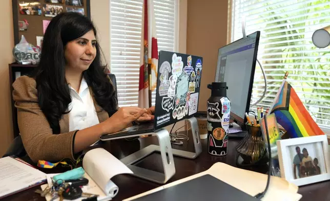 Florida state Rep. Anna Eskamani works in her office Wednesday, March 27, 2024, in Orlando, Fla. For the first time in 27 years, the U.S. government is announcing changes to how it categorizes people by race and ethnicity. "It feels good to be seen," said Eskamani, whose parents are from Iran. (AP Photo/John Raoux) embargoed until 8:45 am tomorrow