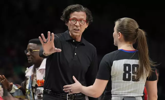 Atlanta Hawks head coach Quin Snyder agrues with official Dannica Mosher (89) during the first half of an NBA basketball game against the Boston Celtics Thursday, March 28, 2024, in Atlanta. (AP Photo/John Bazemore)