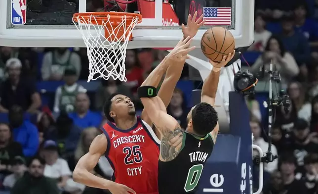 Boston Celtics forward Jayson Tatum (0) shoots against New Orleans Pelicans guard Trey Murphy III (25) in the first half of an NBA basketball game in New Orleans, Saturday, March 30, 2024. (AP Photo/Gerald Herbert)