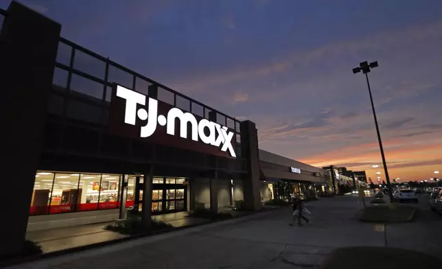 FILE - In this Aug. 15, 2019, photo shoppers enter a T.J. Maxx in Harahan, La.. Don't count on a favorite store being open on Easter Sunday. Several stores will be closed March 31, 2024, in observance of the holiday. (AP Photo/Gerald Herbert)