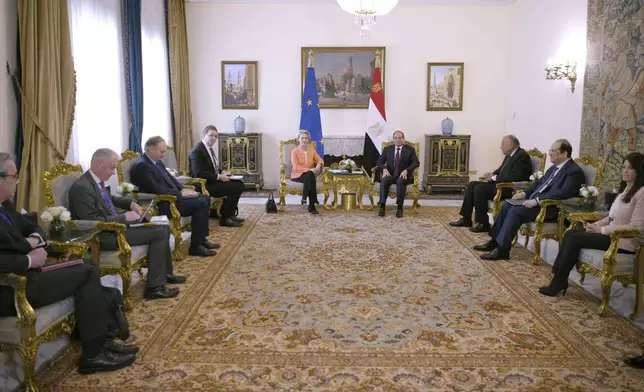 In this photo provided by Egypt's presidency media office, Egyptian President Abdel-Fattah el-Sissi, centre right, meets European Commission president Ursula Von der Leyen, centre left, and her delegations at the Presidential Palace in Cairo, Egypt, Sunday, March 17, 2024. (Egyptian Presidency Media Office via AP)
