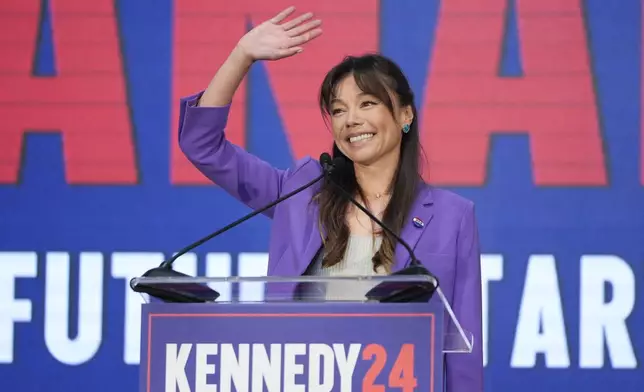 Nicole Shanahan waves from the podium during a campaign event for Presidential candidate Robert F. Kennedy Jr., Tuesday, March 26, 2024, in Oakland, Calif. Shanahan has been picked as Kennedy Jr.'s running mate. (AP Photo/Eric Risberg)