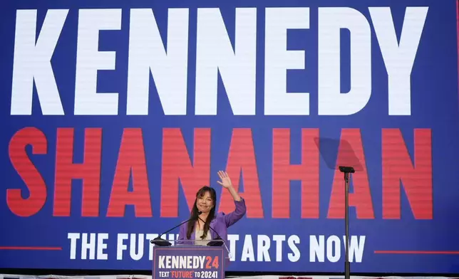 Nicole Shanahan waves from the podium during a campaign event for Presidential candidate Robert F. Kennedy Jr., Tuesday, March 26, 2024, in Oakland, Calif. Shanahan has been picked as Kennedy Jr.'s running mate. (AP Photo/Eric Risberg)