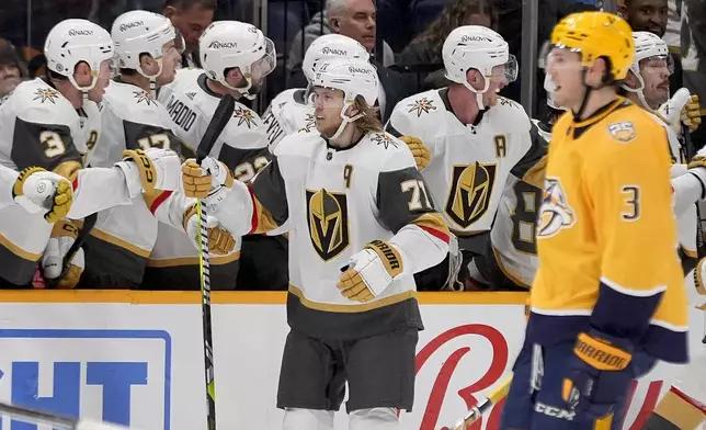 Vegas Golden Knights center William Karlsson (71) celebrates his goal with teammates during the second period of an NHL hockey game against the Nashville Predators, Tuesday, March 26, 2024, in Nashville, Tenn. (AP Photo/George Walker IV)